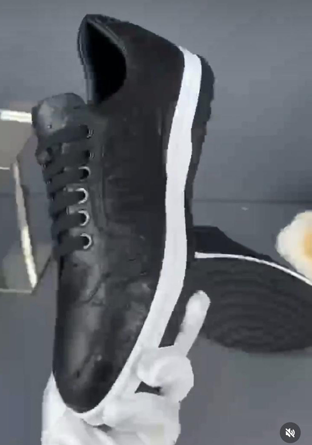 Ostrich skin leather sneaker by Rossie Viren featuring stylish design and textured black leather upper.