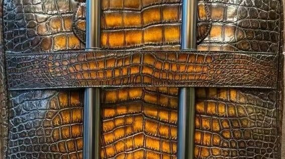 Genuine crocodile skin leather briefcase handbag by Rossie Viren with sleek design and polished finish.