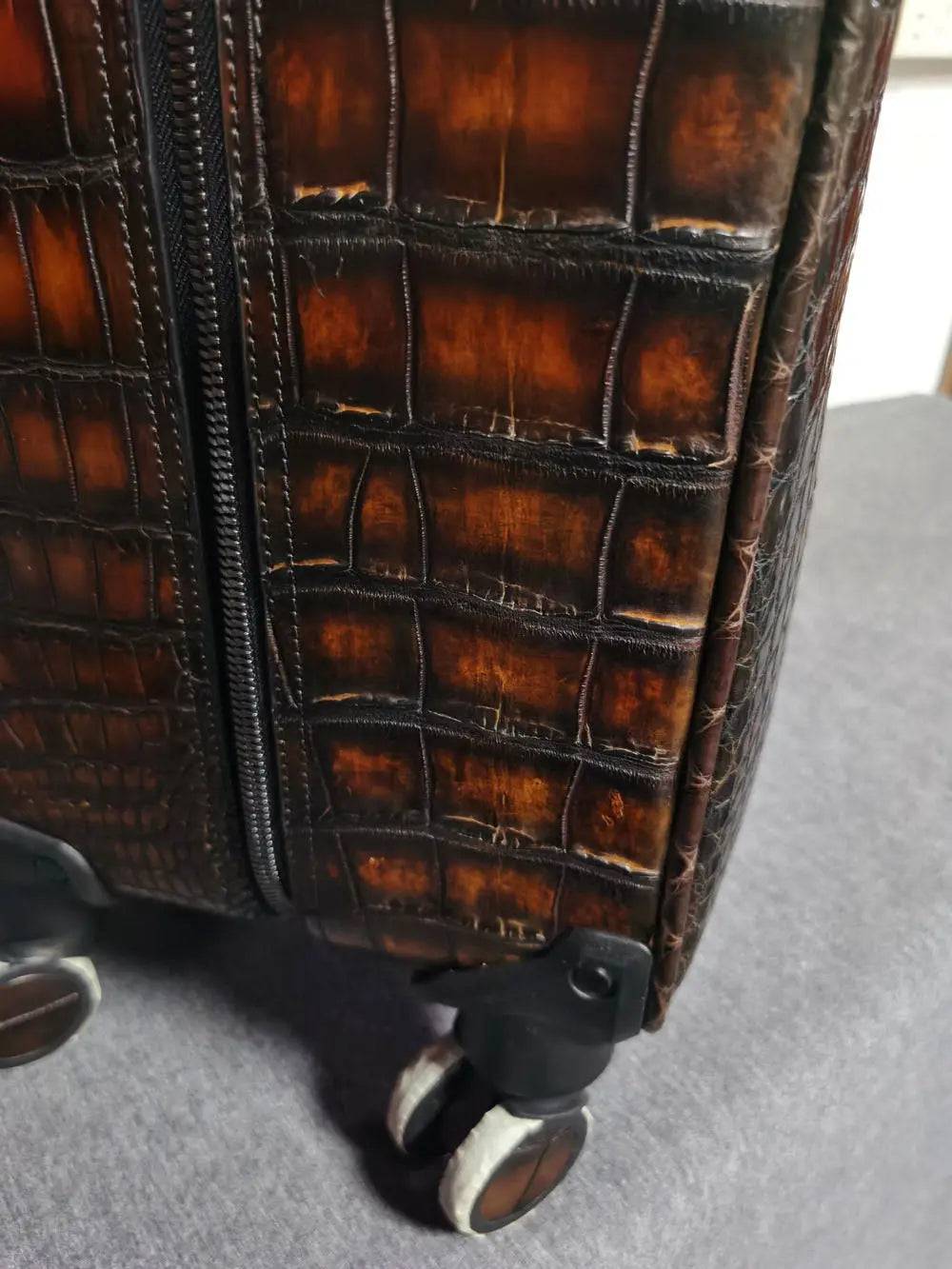 Retro brown crocodile leather trolley suitcase with universal wheels, 20-inch rollaboard travel bag by Rossie Viren.