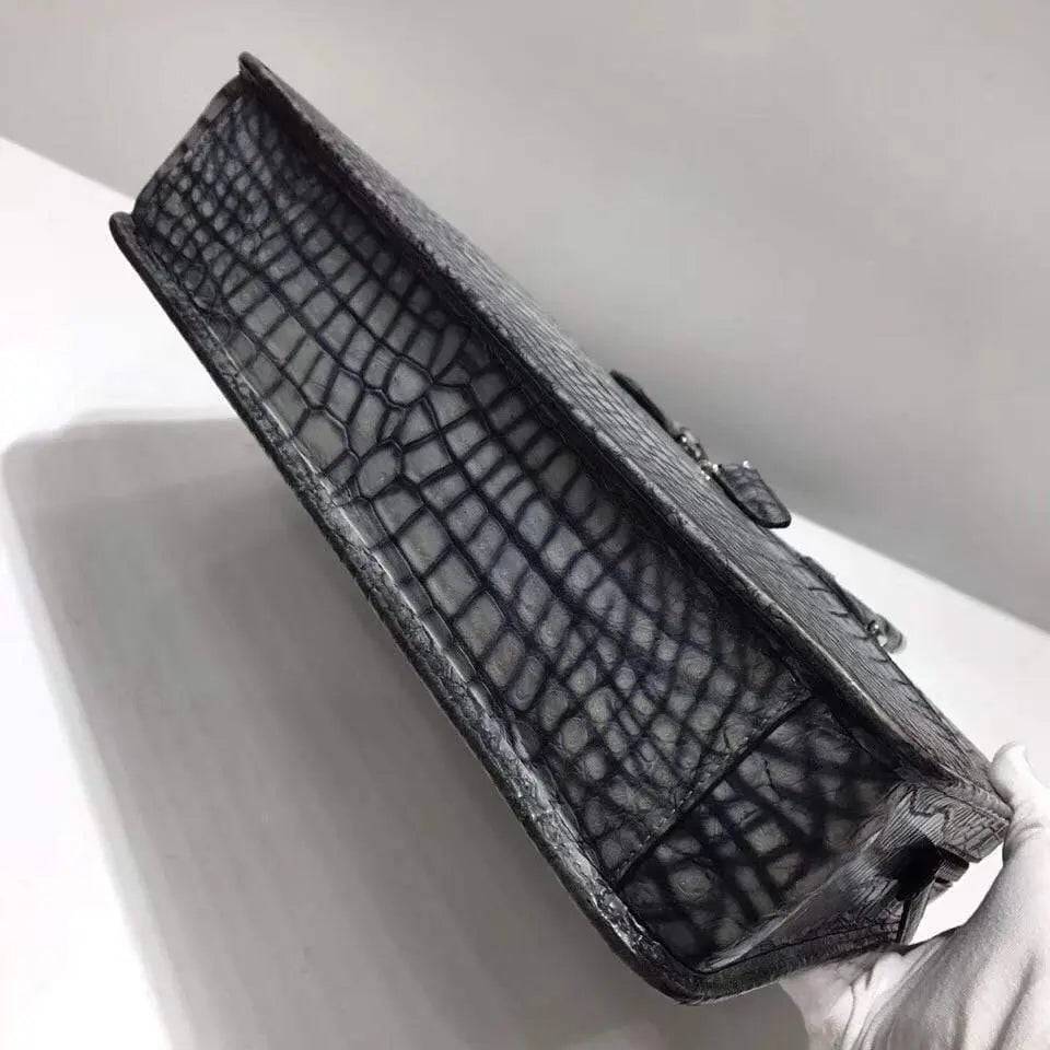 Retro crocodile leather crossbody bag by Rossie Viren, featuring a stylish handbag design with a laptop compartment.