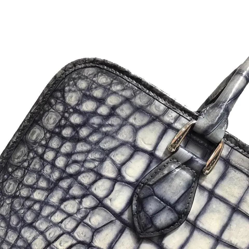 Retro crocodile leather crossbody handbag by Rossie Viren, featuring a sleek design and a spacious compartment for laptops.