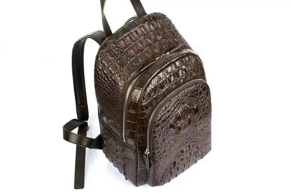 Rossie Viren crocodile skin leather backpack handbag with adjustable straps and front pocket, unisex design in natural leather finish.