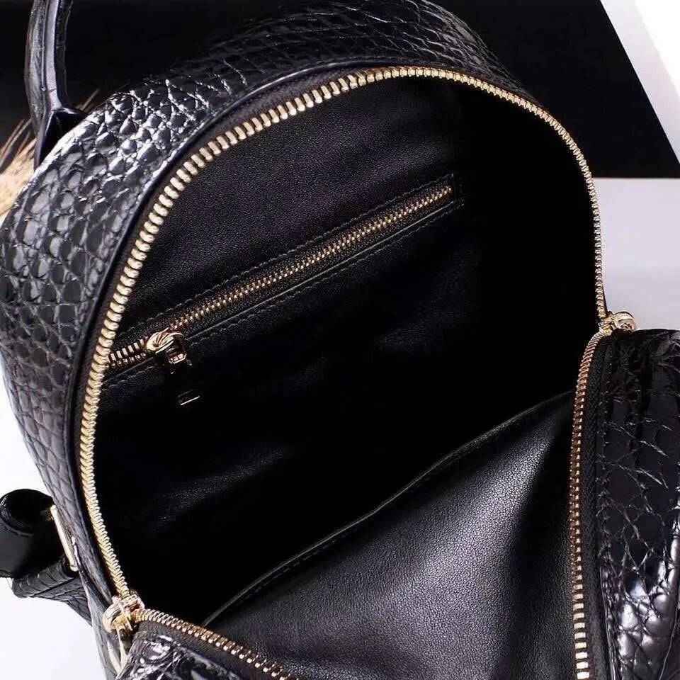 Rossie Viren unisex crocodile skin leather backpack handbag with adjustable straps and multiple compartments.