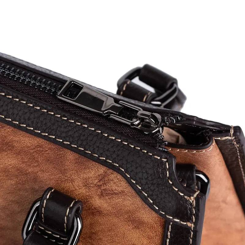 Rossie Viren women's leather handbag with top handle and shoulder strap, featuring a sleek crossbody design and elegant detailing.