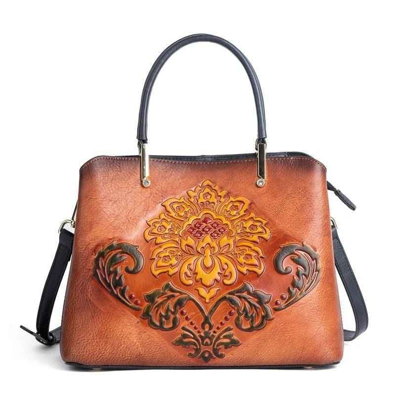 Rossie Viren women's leather handbag with top handle and crossbody strap, featuring a sleek shoulder bag design.