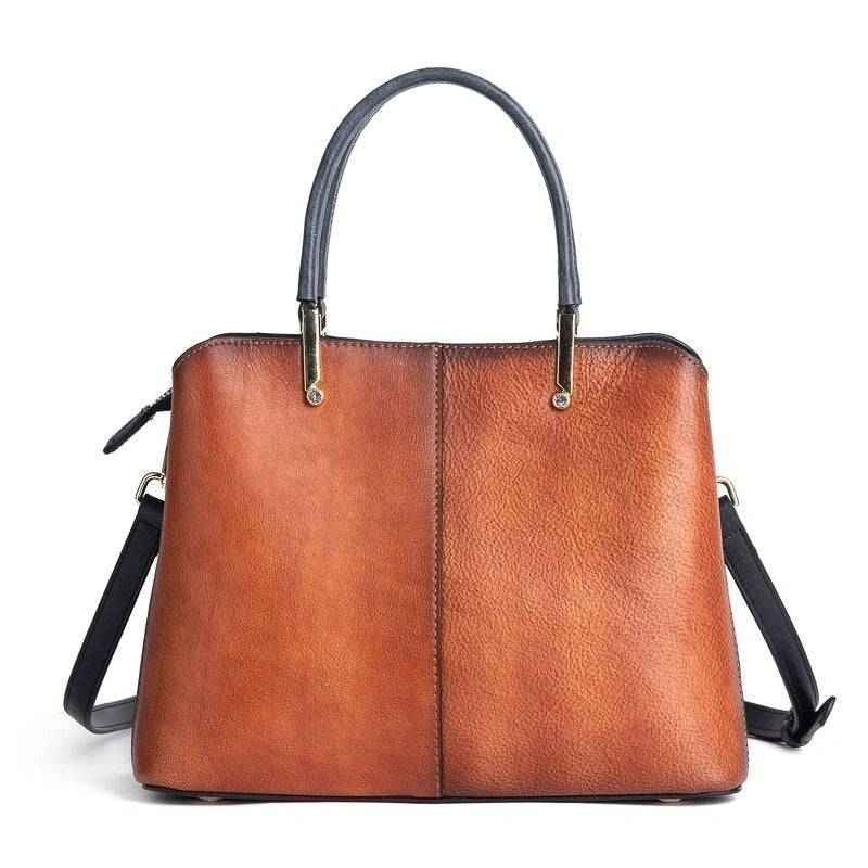 Rossie Viren women's leather handbag with top handle and crossbody strap, featuring a sleek shoulder bag design and gold-tone hardware.