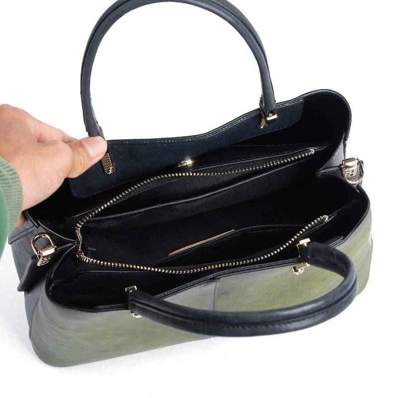 Rossie Viren women's leather handbag with top handle and shoulder strap, featuring a sleek cross-body design and elegant finish.