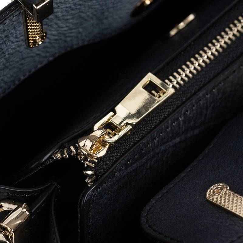 Rossie Viren women's leather handbag with top handle and shoulder strap, featuring a sleek crossbody design with gold hardware accents.