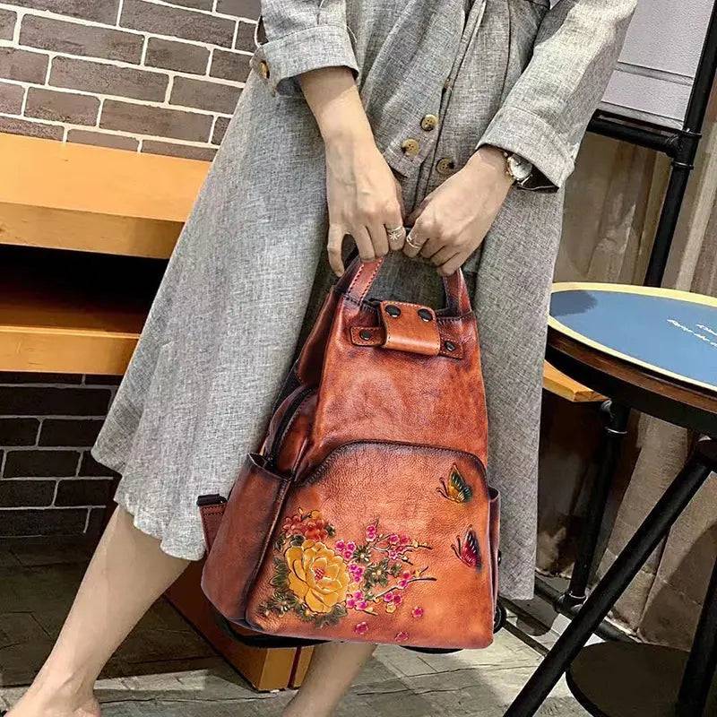Rossie Viren vintage leather backpack with adjustable straps, front pocket, and classic design, ideal for women.