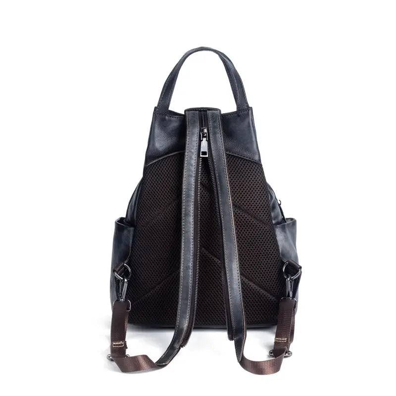 Rossie Viren vintage leather backpack with adjustable straps, front pocket, and classic rucksack design for women.
