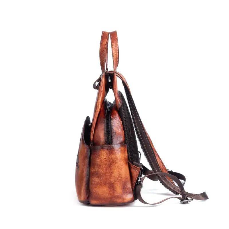 Rossie Viren vintage leather backpack with adjustable straps, front pocket, and classic leather rucksack design for women.