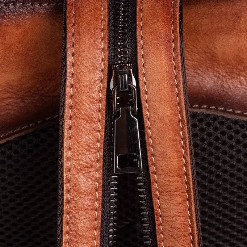 Rossie Viren vintage leather women's backpack with adjustable straps, front pocket, and classic leather design.