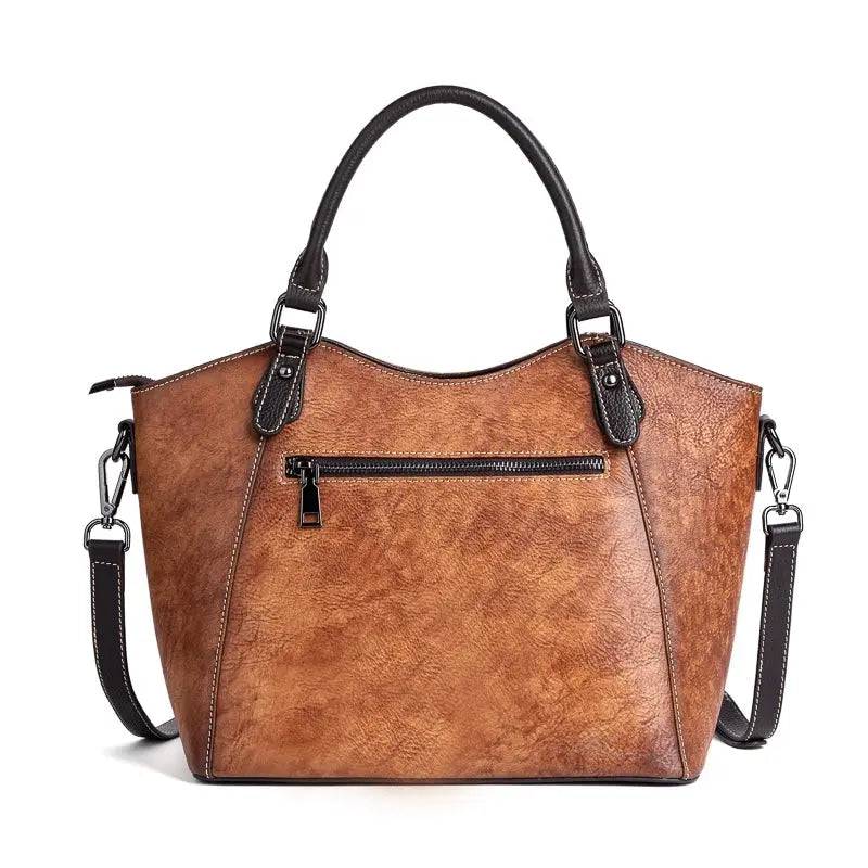 Rossie Viren women's genuine leather handbag with shoulder strap, top handle, tote style, and satchel design.