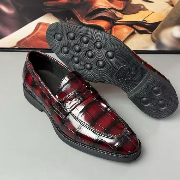 Vintage red crocodile leather loafer shoes by Rossie Viren featuring a sleek slip-on design and textured crocodile pattern.