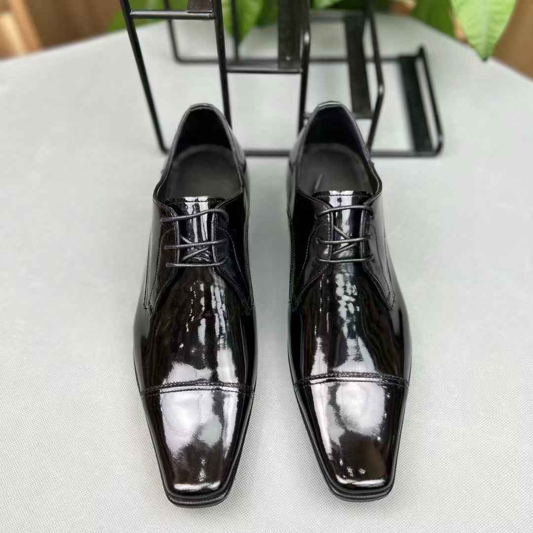 Men's black crocodile leather lace-up shoes by Rossie Viren, showcasing the textured crocodile pattern and polished finish.