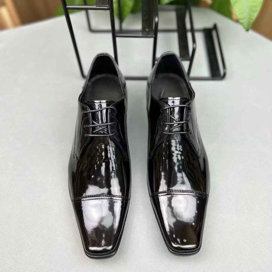 Men's black crocodile leather lace-up shoes by Rossie Viren, showcasing the textured crocodile pattern and polished finish.