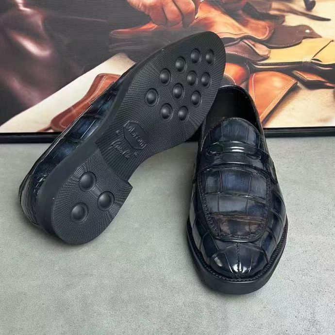 Dark grey vintage crocodile leather loafer shoes by Rossie Viren, showcasing their textured crocodile pattern and classic slip-on style.