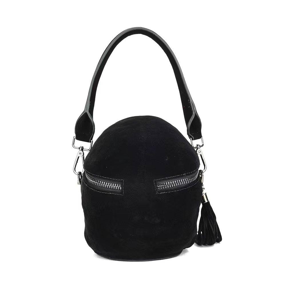 Black suede skull crossbody bag with mini handle from Rossie Viren, featuring a 3D skull design and shoulder strap.