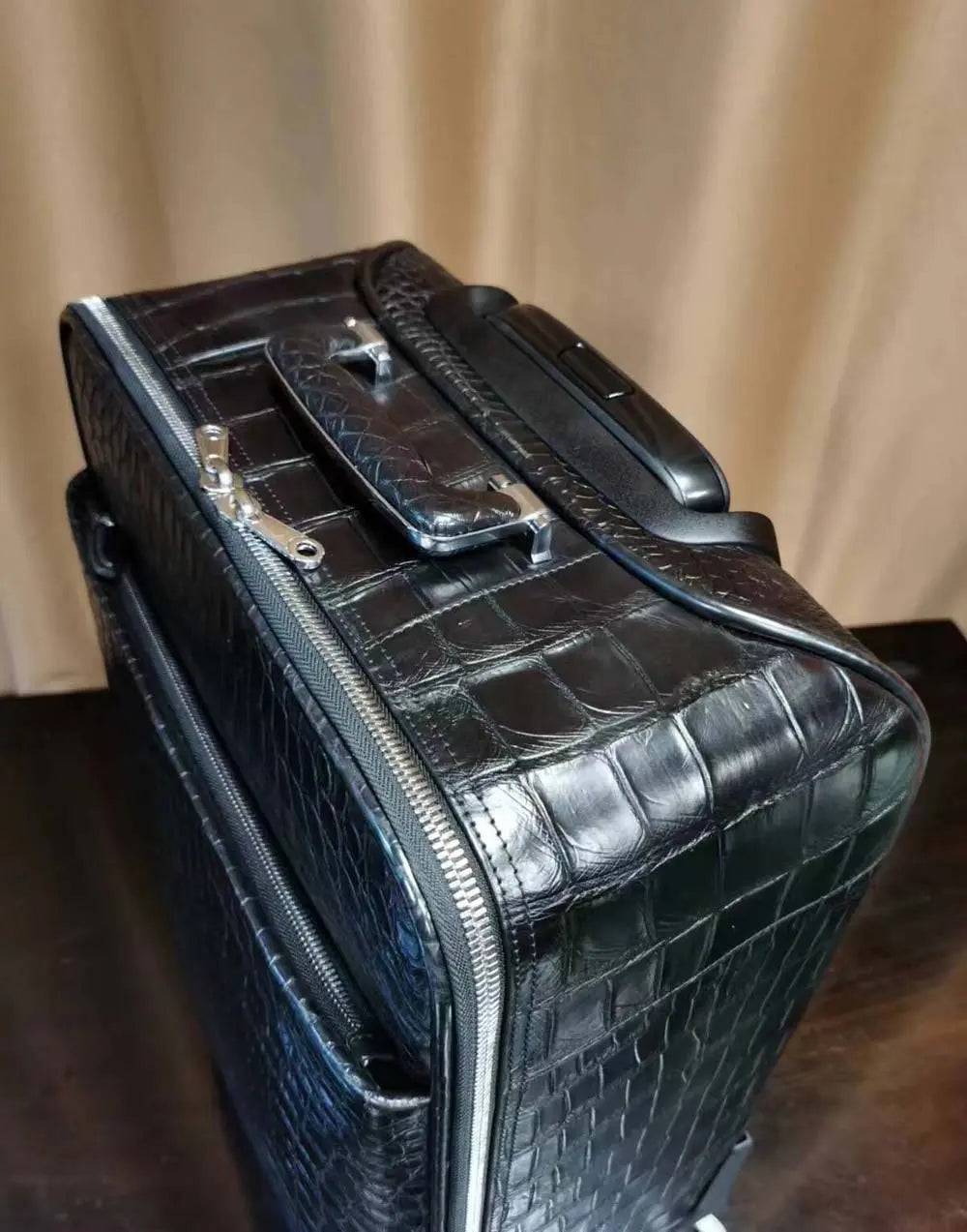 Rossie Viren black crocodile skin leather 20-inch trolley suitcase with universal wheels and rollaboard design for travel and weekend trips.