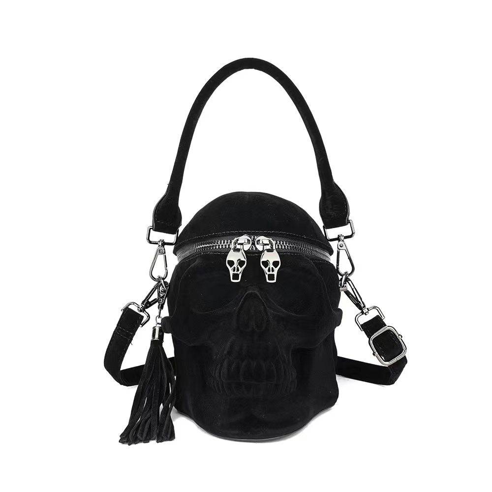 Black suede 3D skull crossbody shoulder bag with mini handle from Rossie Viren, featuring a stylish and edgy design.