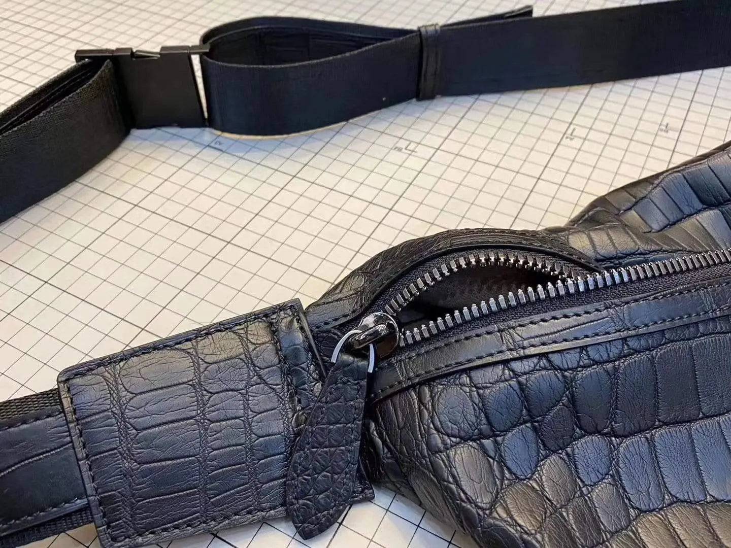 Unisex crocodile leather waist fanny pack by Rossie Viren, showcasing a compact handbag design with adjustable strap and textured finish.