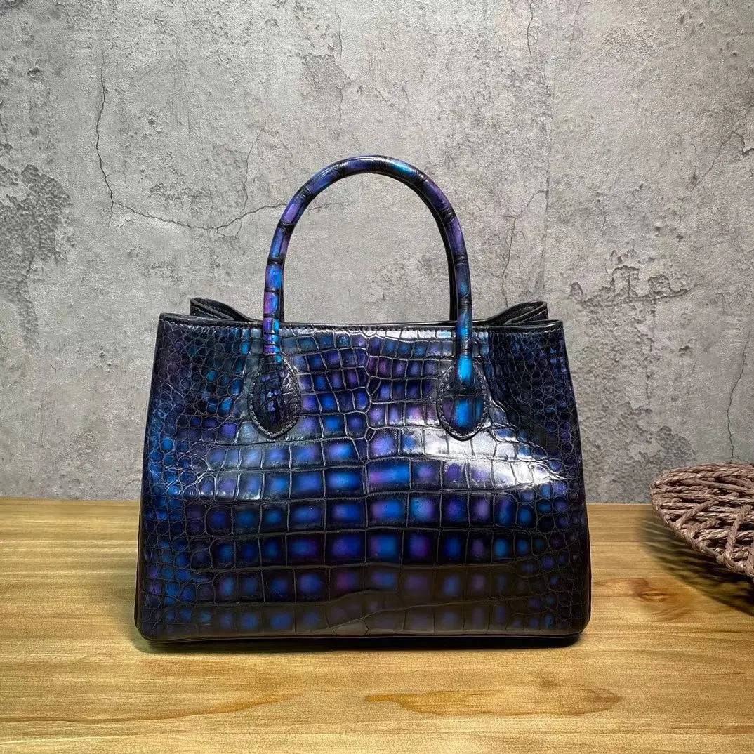 Vintage blue crocodile leather handbag with top handle, shoulder strap, tote style, 30cm size, by Rossie Viren.