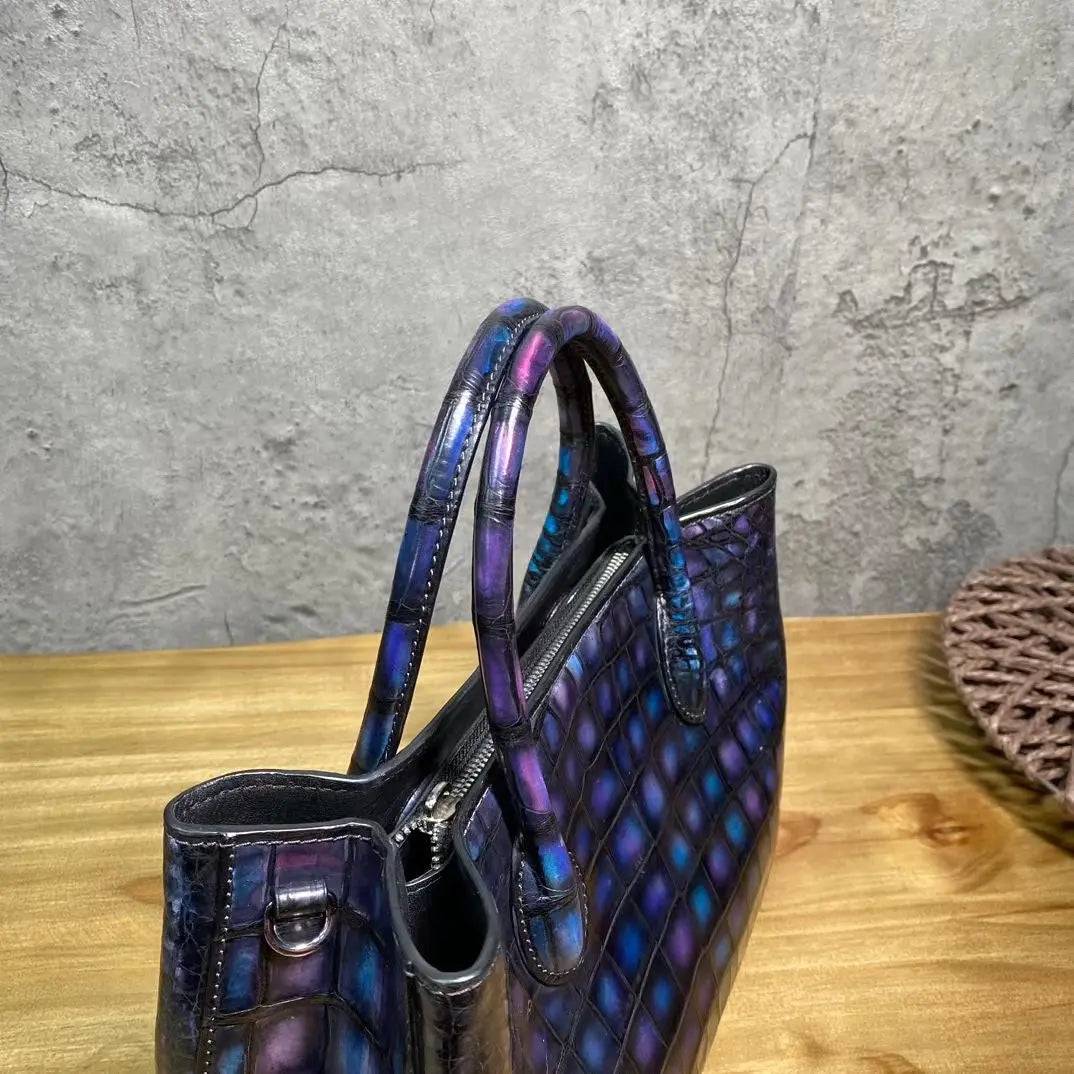 Vintage blue crocodile leather handbag with top handle, shoulder strap, tote style, and 30cm size by Rossie Viren.