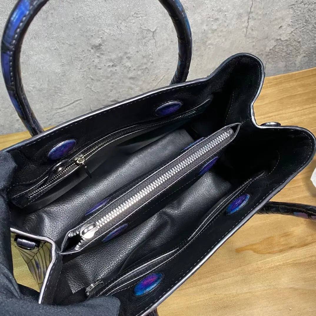 Vintage genuine crocodile leather top handle handbag by Rossie Viren, showcasing a blue tote with sturdy shoulder strap and elegant design.