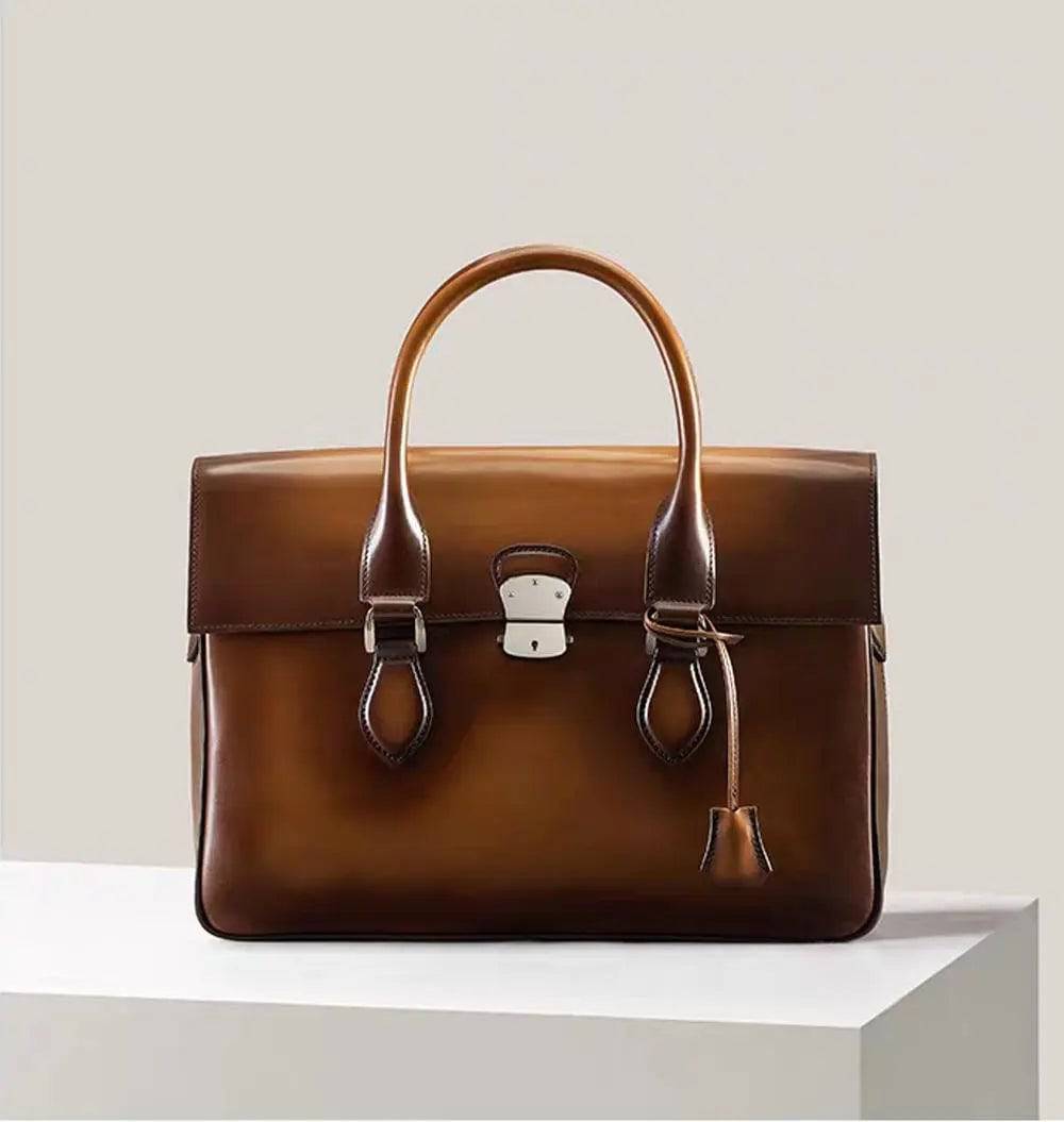 Vintage large blue cowhide leather foldover briefcase handbag by Rossie Viren, featuring smooth texture and sturdy handle.