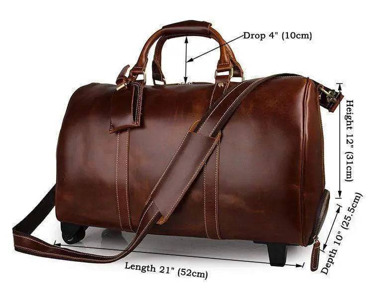 Vintage tan leather Rossie Viren carry-on luggage bag with sturdy handles, detailed stitching, and classic design for travel.