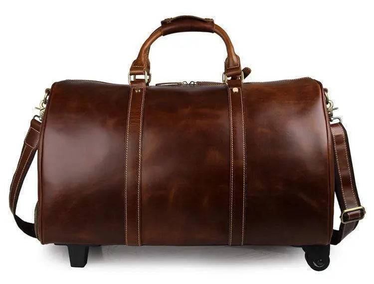 Vintage tan leather carry-on luggage bag by Rossie Viren, stylish handcrafted handbag with sturdy handles and classic design.