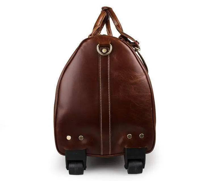 Vintage tan leather handbag with carry-on luggage design by Rossie Viren, featuring sturdy handles and classic vintage style.