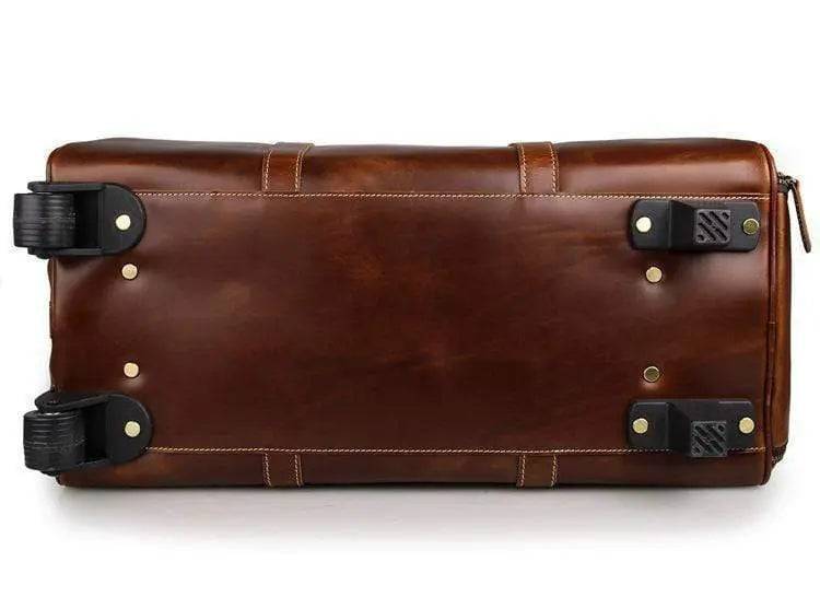 Vintage tan leather Rossie Viren handbag with carry-on luggage style design, featuring sturdy handles and classic leather texture.