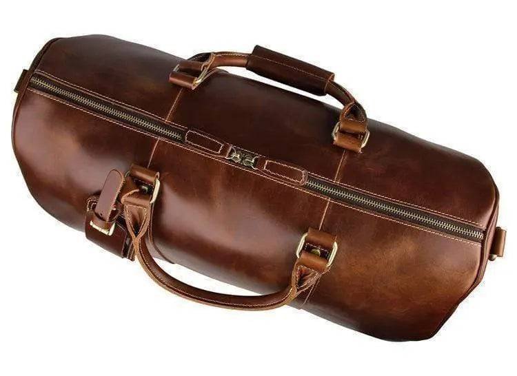 Vintage tan leather Rossie Viren carry-on luggage bag with sturdy handle and classic design, perfect for travel and stylish storage.