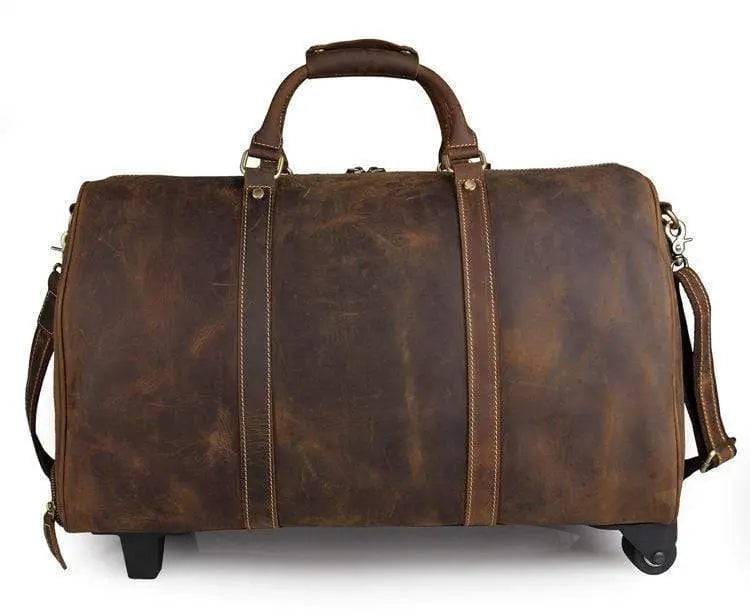 Vintage tan leather handbag with carry-on luggage style design from Rossie Viren, featuring sturdy handles and classic leather craftsmanship.