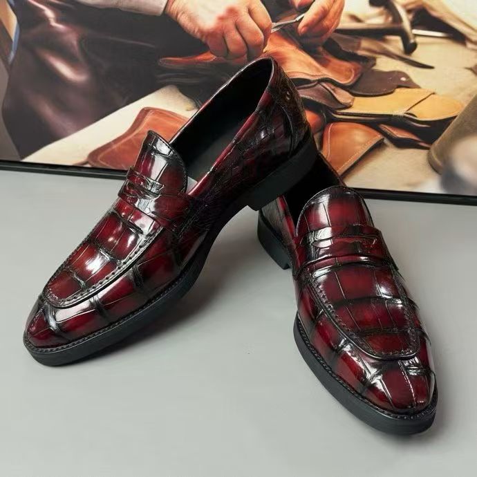 Vintage red crocodile leather loafer shoes by Rossie Viren, showcasing sleek design and textured crocodile pattern.