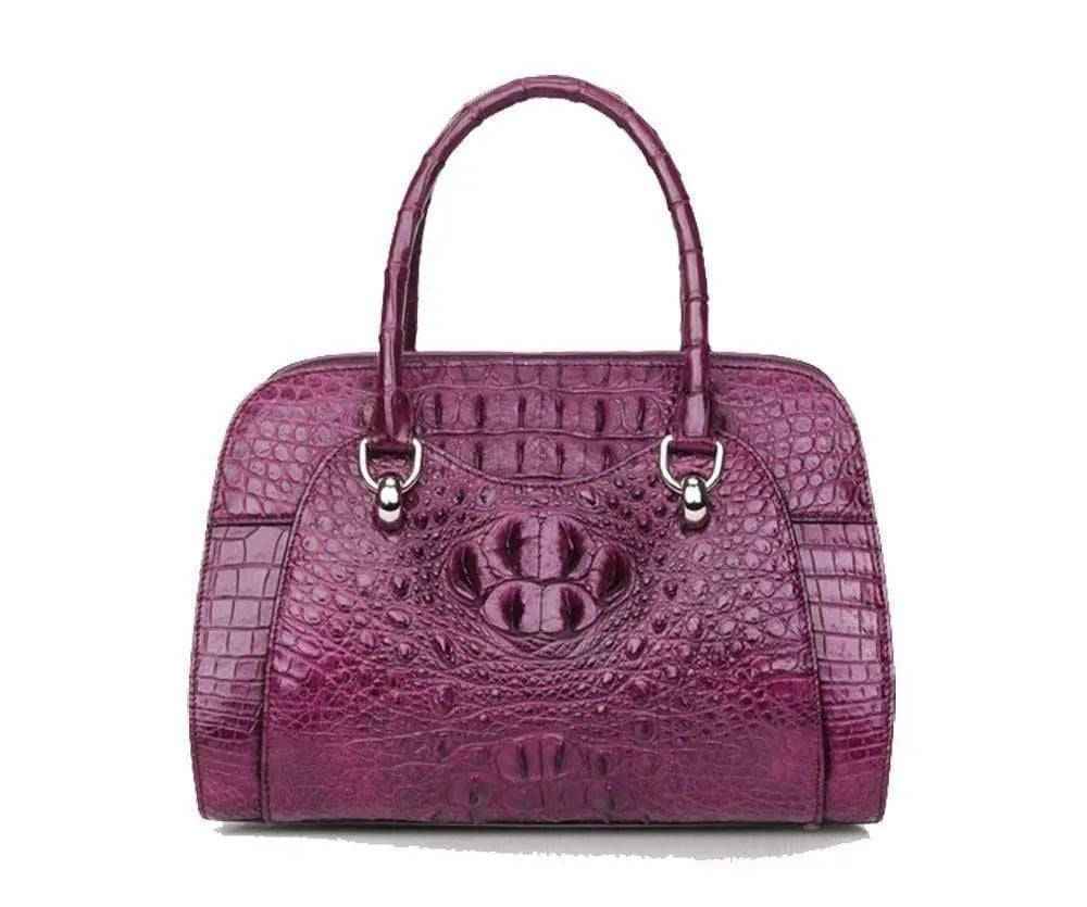 Women’s crocodile leather dome satchel handbag by Rossie Viren with double handles and gold-tone accents.