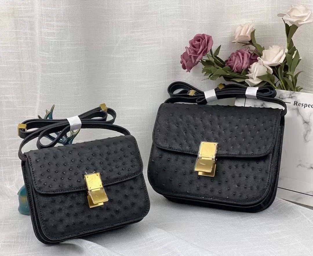 Women’s ostrich leather cross body messenger handbag by Rossie Viren, featuring a sleek shoulder strap and textured leather finish.
