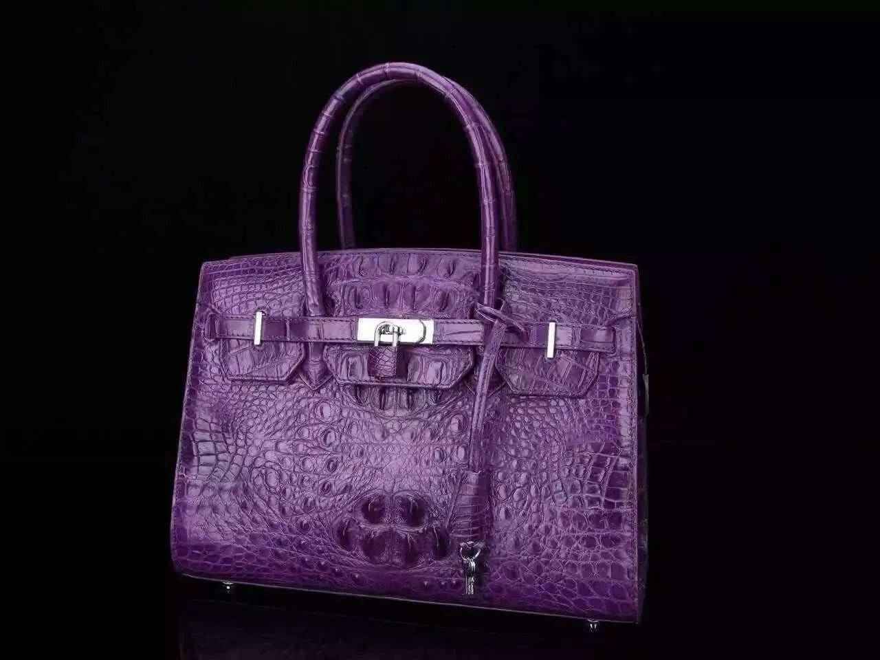 Women's genuine crocodile leather tote handbag with padlock closure by Rossie Viren, featuring a sleek and textured design.