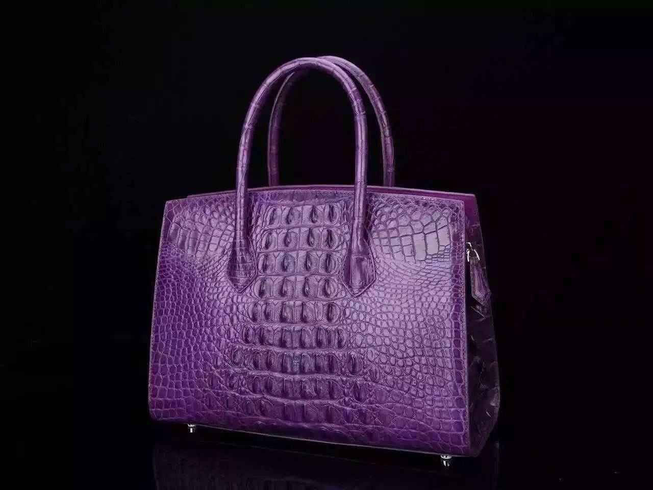 Women's genuine crocodile leather tote handbag with padlock closure by Rossie Viren, featuring a sleek, textured crocodile pattern.