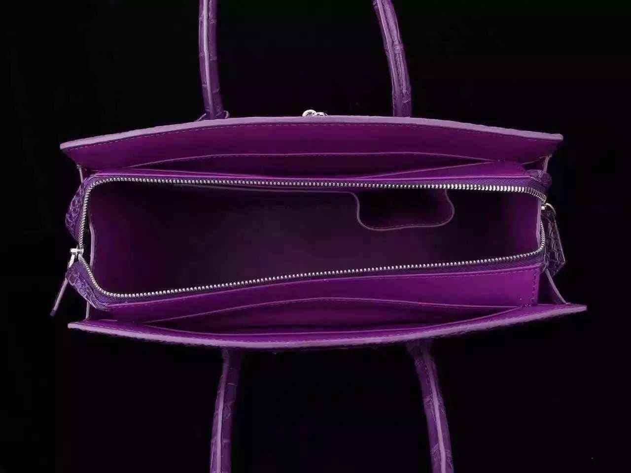 Women's genuine crocodile leather tote handbag with a padlock closure, featuring a spacious interior and elegant design.