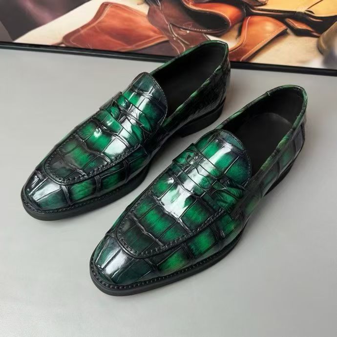 Vintage green crocodile leather loafer shoes by Rossie Viren, showcasing detailed crocodile texture and classic slip-on design.