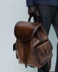 Unisex black crocodile leather backpack handbag by Rossie Viren, featuring a compact design and adjustable straps.