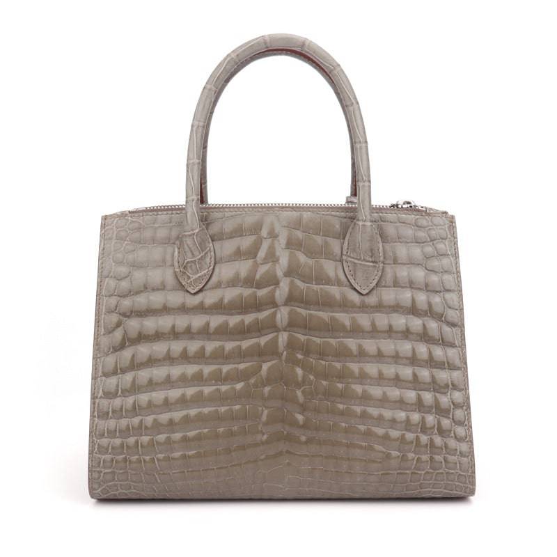 Shiny beaded crocodile skin leather cross body handbag with top handle by Rossie Viren, featuring a sleek and stylish design.