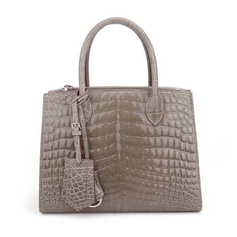 Beaded shiny crocodile skin leather crossbody handbag with top handle by Rossie Viren, featuring elegant design and craftsmanship.