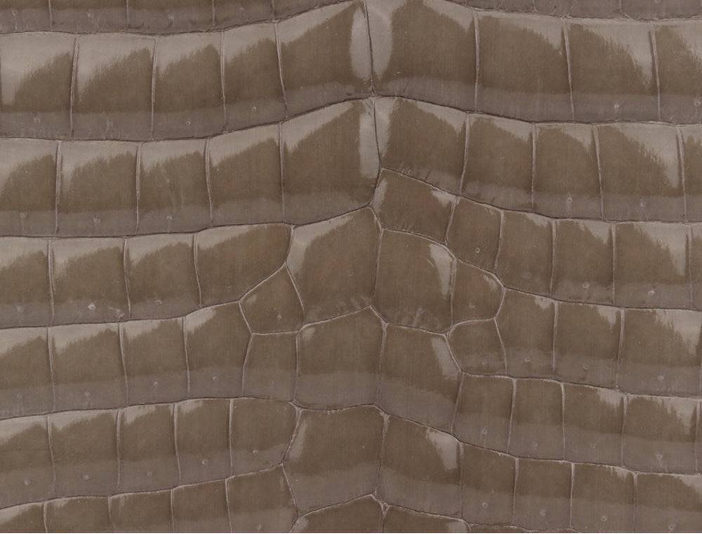 Beaded shiny crocodile skin leather crossbody handbag with top handle by Rossie Viren, featuring intricate bead details and elegant design.