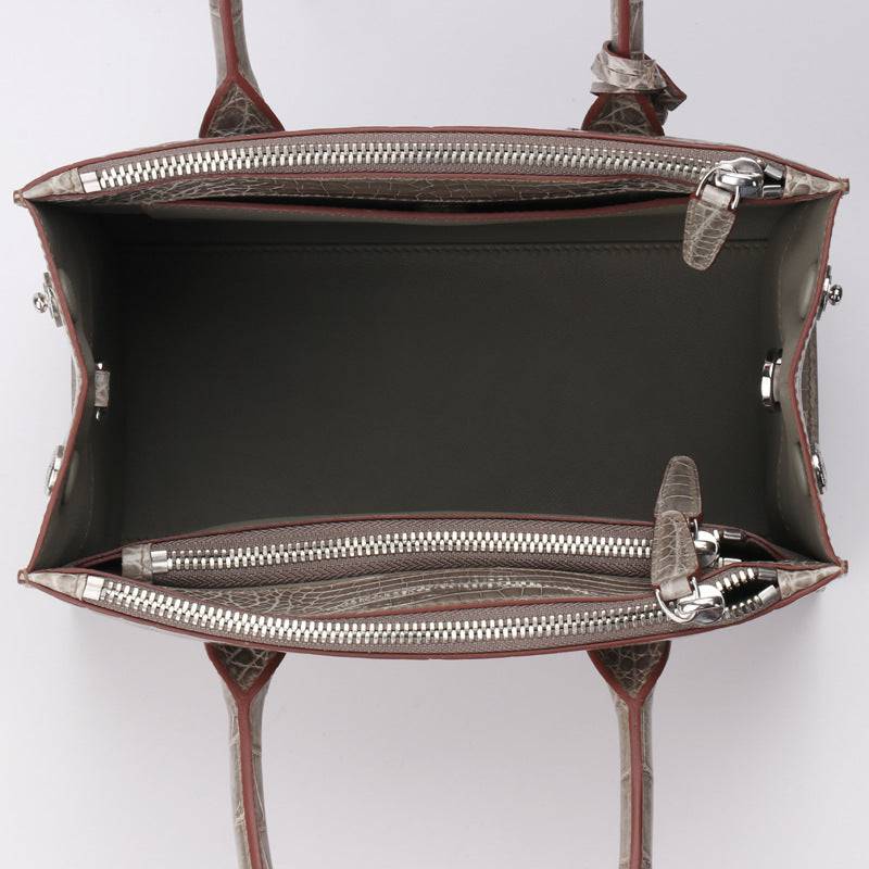 Beaded high-shiny crocodile skin leather crossbody handbag with top handle by Rossie Viren, featuring elegant design and detailed embellishments.