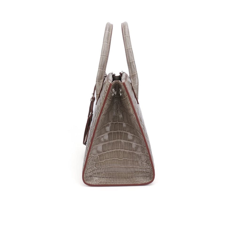 Beaded shiny crocodile skin leather crossbody handbag with top handle by Rossie Viren, featuring intricate bead detailing.