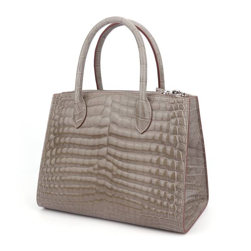 Beaded shiny crocodile skin leather crossbody handbag with top handle from Rossie Viren, stylish and luxurious accessory.