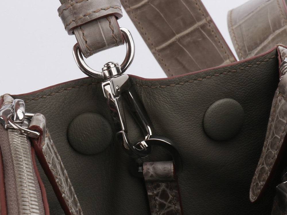 Rossie Viren beaded crocodile skin leather handbag with shiny finish, crossbody style, top handle, and intricate bead detailing.